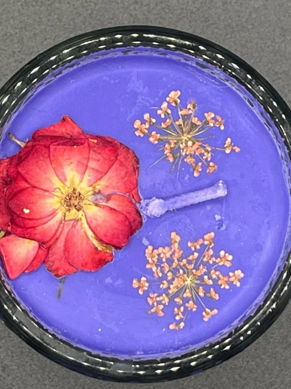 Embossed Fleur-de-Lis Glass Candle with Purple Wax and Pressed Red Flower